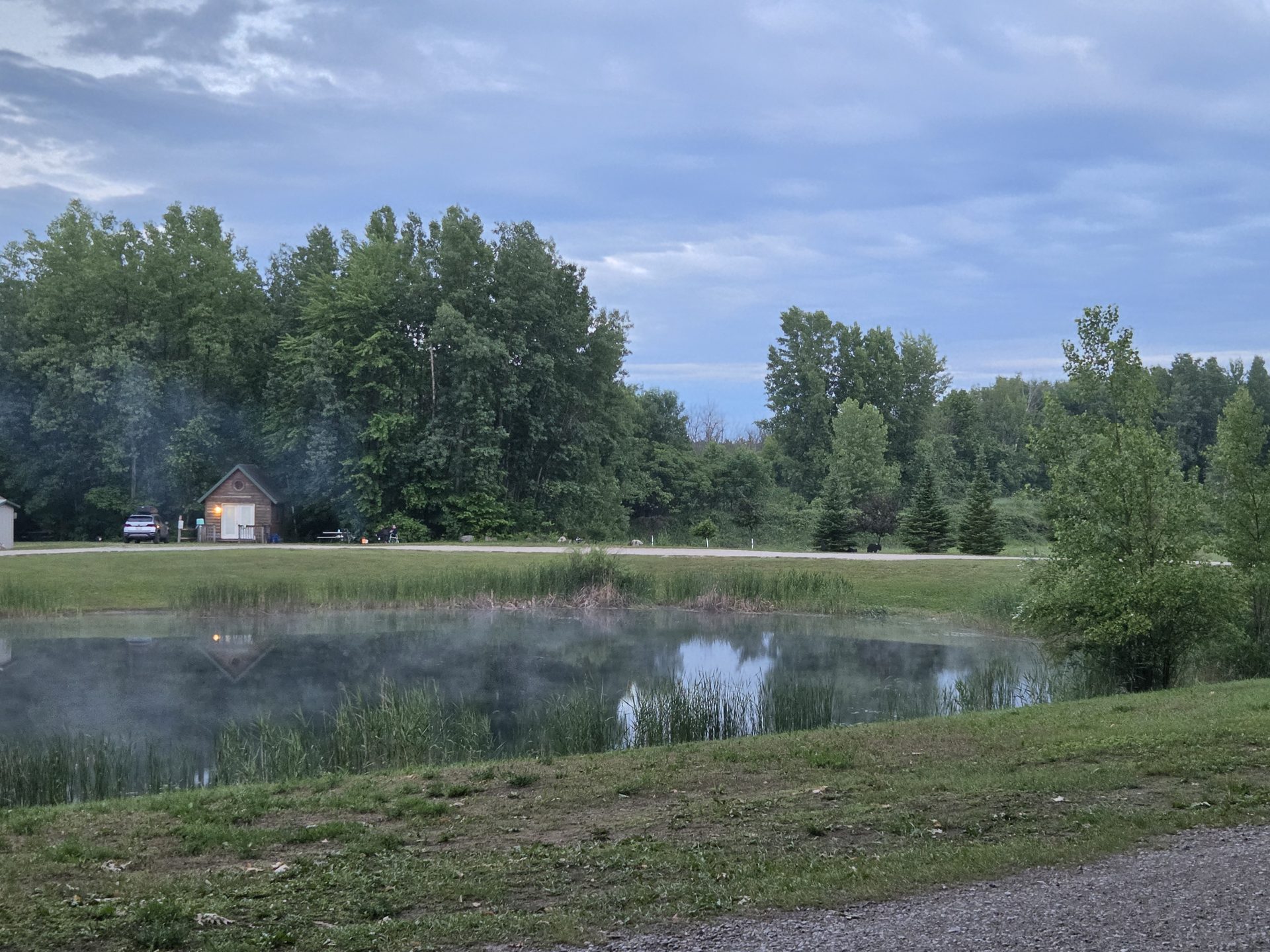 Misty lake at dusk at Diamond Lake Campground
